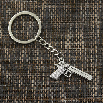 Nové Módne Keychain 45*20 mm guľomet browning pištole Prívesky DIY Mužov Šperky Auto Kľúč Reťazca Krúžok Držiak Suvenír Pre Darček